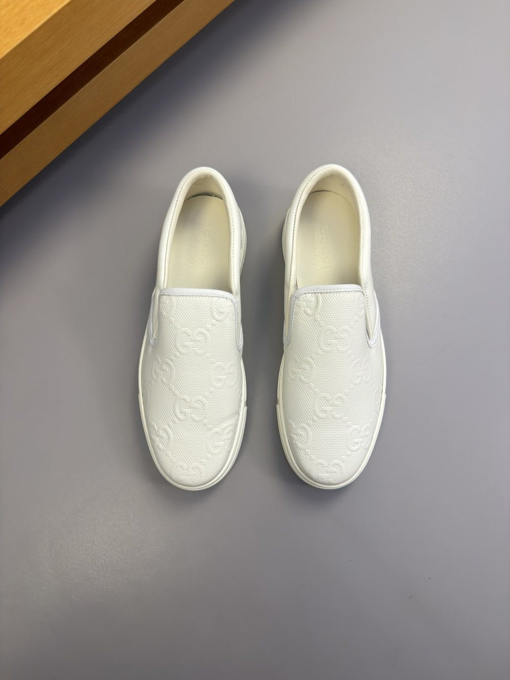Ivory White Embossed Slip-On Sneakers